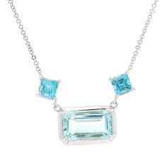 --Stone(s):-- (1) Natural Genuine Aquamarine - Emerald Cut - Prong Set - Sky Blue Color -  3.35ct (exact) (2) Natural Genuine Blue Topaz - Square Step Cut - Prong Set - Blue Color - 1.04ctw (exact) Total Carat Weight: 4.39 (exact) Material: 14k White Gold Weight: 5.24 Grams Chain Type: Adjustable at 17" or 19" - Cable Link - Lobster Claw Clasp Pendant Height: 9.36mm (0.38") (approx.) Pendant Width: 13.6mm (0.53") (at the aquamarine), 29.2mm (1.1") (topaz to topaz) Pendant Thickness: 5.4mm (appro Blue Topaz Pendant Necklace, Sky Blue Color, Blue Topaz Pendant, Topaz Pendant, Step Cut, Aquamarine Blue, Fine Jewellery Necklace, Emerald Cut, Blue Topaz