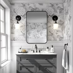 a bathroom vanity with two sinks and a large mirror above it, in front of a window