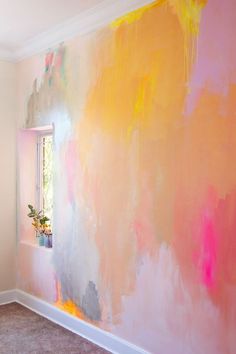 an image of a room that has been decorated with colorful paint on the walls and floor