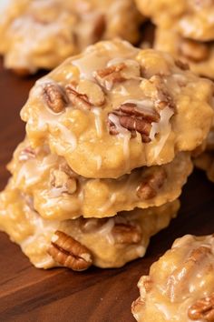 cookies with pecans and icing on a wooden table