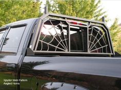 the back end of a pickup truck with a decorative window