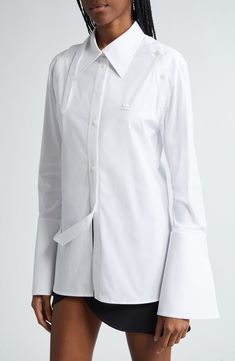 "Find COURREGES Modular Stretch Cotton Poplin Button-up Shirt on Editorialist. Creatively placed plackets bring the label's innovative touch to a stretch-cotton shirt that's framed by fluted sleeves. 29\" front length; 30\" back length (size 38 EU) Front button closure Spread collar Long sleeves with button cuffs Back vent 96% cotton, 4% elastane Dry clean or machine wash, dry flat Made in Italy Designer Clothing" Fluted Sleeves, White Shirts, Cotton Poplin, Stretch Cotton, Cotton Shirt, Button Up Shirts, Designer Clothing, Button Up, Dry Clean