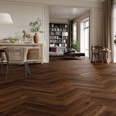 a living room filled with furniture and lots of wood flooring on top of a hard wood floor