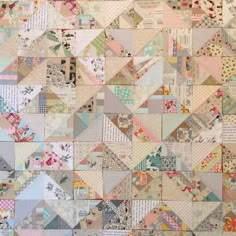 an old patchwork quilt with many different patterns