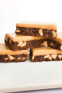 four pieces of brownie on a white plate