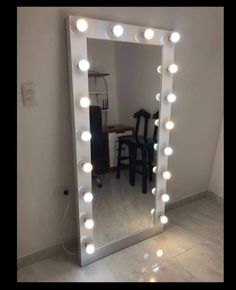 a mirror that has some lights on it