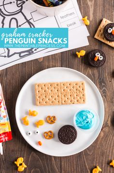 a plate with cookies, crackers and candy on it