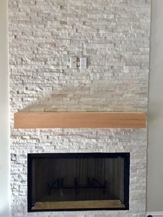 a white brick fireplace in a living room