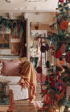 a living room filled with lots of christmas decorations and decorating on the walls,