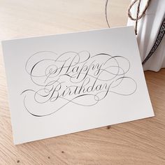 a birthday card sitting on top of a wooden table