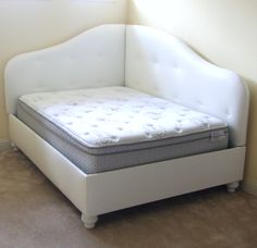 a white couch with a mattress on it