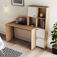 a wooden desk with two white drawers and a potted plant on the floor next to it