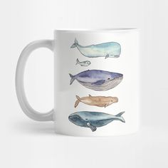 three whale mugs sitting on top of a white table next to eachother