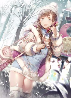 a girl in winter clothes holding a cell phone