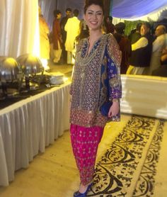 a woman standing in front of a buffet table