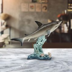 a figurine of a shark on a table