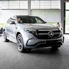 a mercedes suv is parked in a showroom