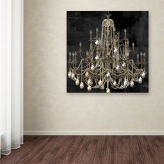 a chandelier hanging on the wall in an empty room