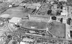 an aerial view of the football stadium and surrounding buildings in black and white, taken from above