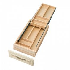 an open drawer with two compartments on the bottom and one in the middle that is empty