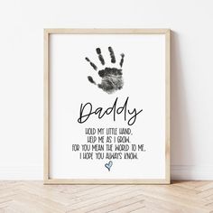 a framed print with the words daddy and hand prints