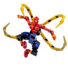 a spider man action figure made out of legos on a white background with the arms and legs extended