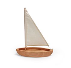 a small wooden sailboat on a white background