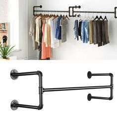 there is a rack with clothes hanging on it next to a wall mounted coat rack