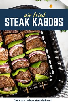 steak kabobs on skewers in a grill pan with text overlay