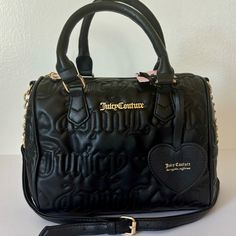 Juicy Couture Bestsellers Fame Satchel Condition: New With Tags Color: Black Liquorice * Black Faux Leather W/ Quilted Juicy Logos * Gold Tone Hardware * Rolled Carry Handles W/ 5” Drop * Adjustable Crossbody Strap W/ 23” Drop (Not Detachable) * Top Zip Closure * Fabric Lined Interior W/ 1 Zip Pocket And 2 Slip Pockets *Measurements: 9.5"W X 8"H X 5"D Msrp $99.00 Black Liquorice, Juicy Bag, Full Wardrobe, Juicy Couture Purse, Black Licorice, Juicy Couture Black, Juicy Couture Bags, Couture Bags, Mini Tote Bag