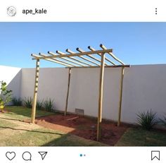 a white fence with wooden posts in the yard