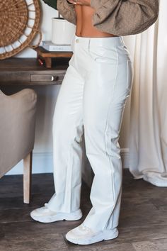 Shimmer in the Brooklyn Pants! These a great twist on a classic white faux leather pants Patent shimmer faux leather pants 55% Polyurethane 45% Viscose Rayon Fitted leather pants Front pockets Button closure No elastic or stretch Belt loops Runs small - Model sized up! Model is wearing a size Medium. She is 5'6". 135lbs. Bust: 34C Waist 26" Hips 36" Fitted Leather Pants, White Leather Pants, Kill Bill, Stretch Belt, Viscose Rayon, Pants Large, Faux Leather Pants, Cute Simple Outfits, Classic White