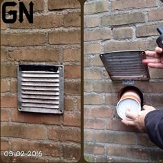 a person is holding a coffee cup in front of a brick wall with a heater on it