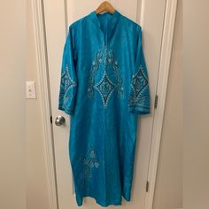 Nwot Came With Light Fabric Defects! Hardly Visible But There Are Different Spots Of The Fabric Looks Darker Than Others. This Would Usually Sell For $150 But Due To Defect There Price Is Discounted! True To Color! Has Silver And Different Shades Of Blue Embroidered Design Throughout The Dress And Sleeve Area! This Is Made In Saudi Arabia And Is A True To Size L. Dimensions Listed Below. It Is Very Cute For Ramadan Outings As Well! I Have A Small Middle Eastern Traditional Clothes And Souvenirs Blue Festive Kaftan Straight Kurta, Festive Blue Straight Kurta Kaftan, Blue Embroidered Straight Kurta Kaftan, Long Sleeve Embroidered Agbada For Festive Occasions, Long Sleeve Embroidered Agbada For Festivals, Blue Long Sleeve Agbada For Eid, Embroidered Long Sleeve Agbada For Festive Occasions, Blue Long Sleeve Thobe For Eid, Blue Agbada With Dabka Detail