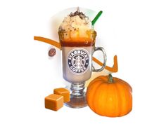 an ice cream sundae with caramel and whipped cream on top, sitting next to a pumpkin