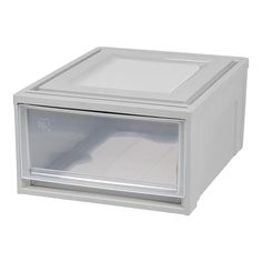 a small white box with an open window on the front and bottom, sitting on a white surface