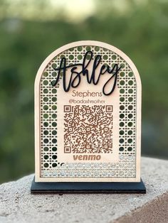 a qr - code is displayed on top of a stone block that reads asley