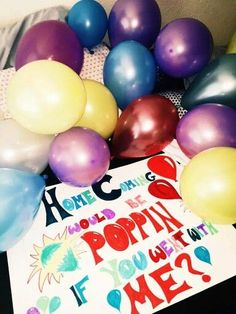 some balloons and a sign that says home is where the poppin's are