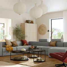 a living room filled with lots of green furniture