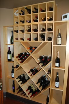 a wine rack filled with lots of bottles