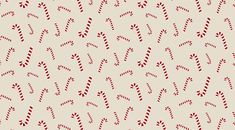 a pattern with candy canes on a beige background