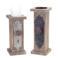 two wooden candlestick holders with one candle and the other holding a lit candle in it