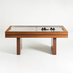 a wooden table with a glass top on it