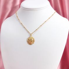 "This listing is for a resizable 18k gold plated sun charm necklace with gold plated stainless steel chain. Necklace is 16.5\" with a 2.5\" extension, max length is 19\". Great for layering!" Tarnish Resistant 14k Gold Filled Gold-tone Charm Necklaces, Gold Dainty Sun Design Charm Necklace, Dainty Gold Charm Necklace With Sun Design, Gold Sun-shaped Jewelry For Everyday, Gold Plated Sun Design Jewelry, Gold Sunburst Jewelry With Sun And Moon Design, Gold Brass Jewelry With Sun Design, Everyday Gold Jewelry With Sun And Moon Design, Gold Jewelry With Sun Design In Brass