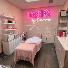 a pink room with a bed, desk and shelves on the wall that says lashes by diamond