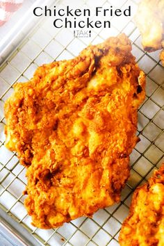 fried chicken is sitting on a cooling rack