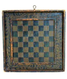 an old wooden frame with a chess board on it