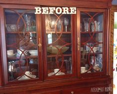 an old china cabinet with glass doors that says before