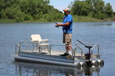 a man standing on top of a boat holding a fishing pole