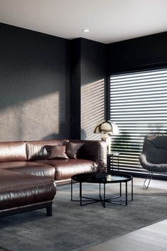 a modern living room with leather furniture and blinds on the windowsill, in front of a large window